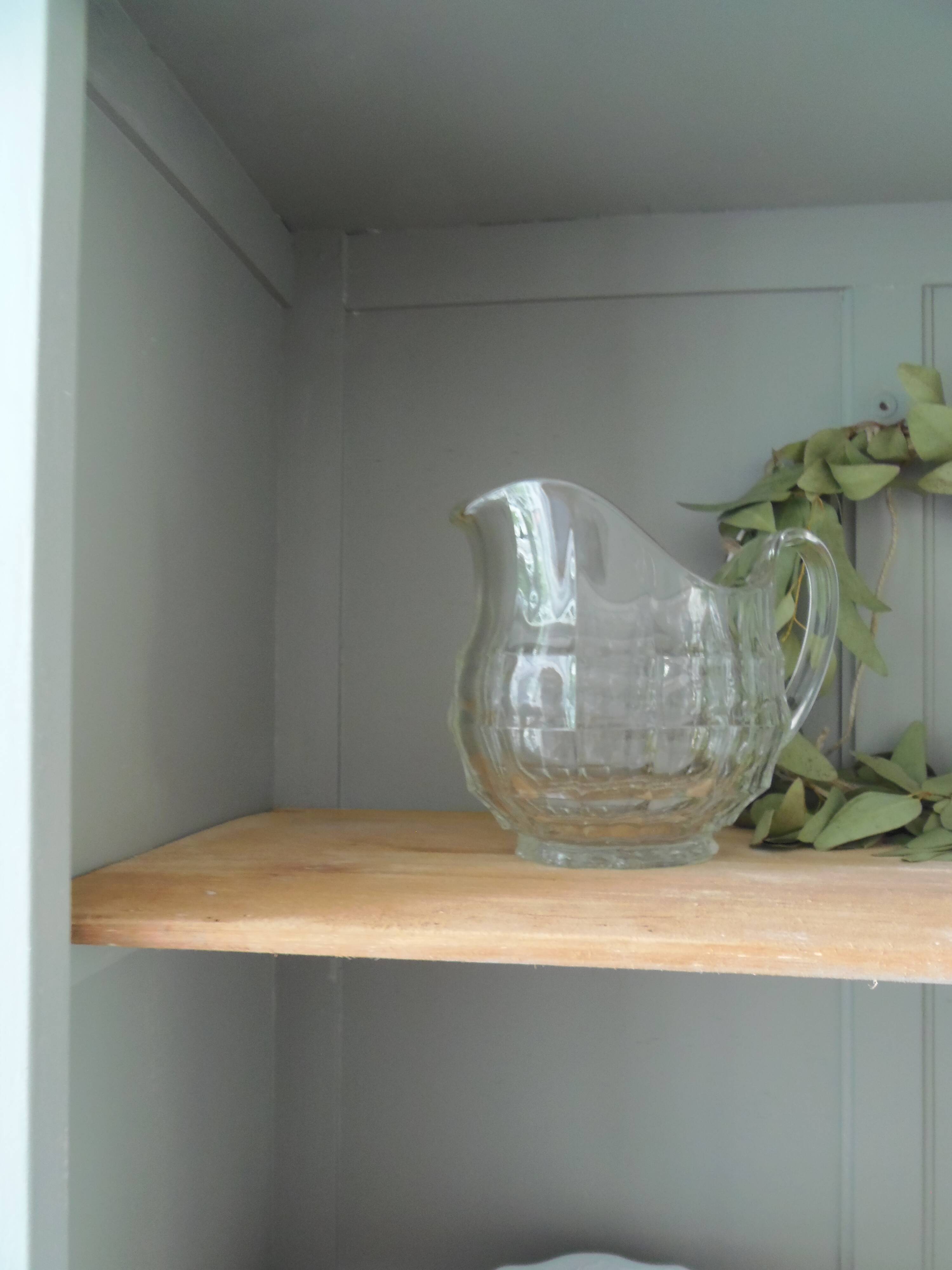 Vintage shallow bookcase re-enchanted in verdigris.