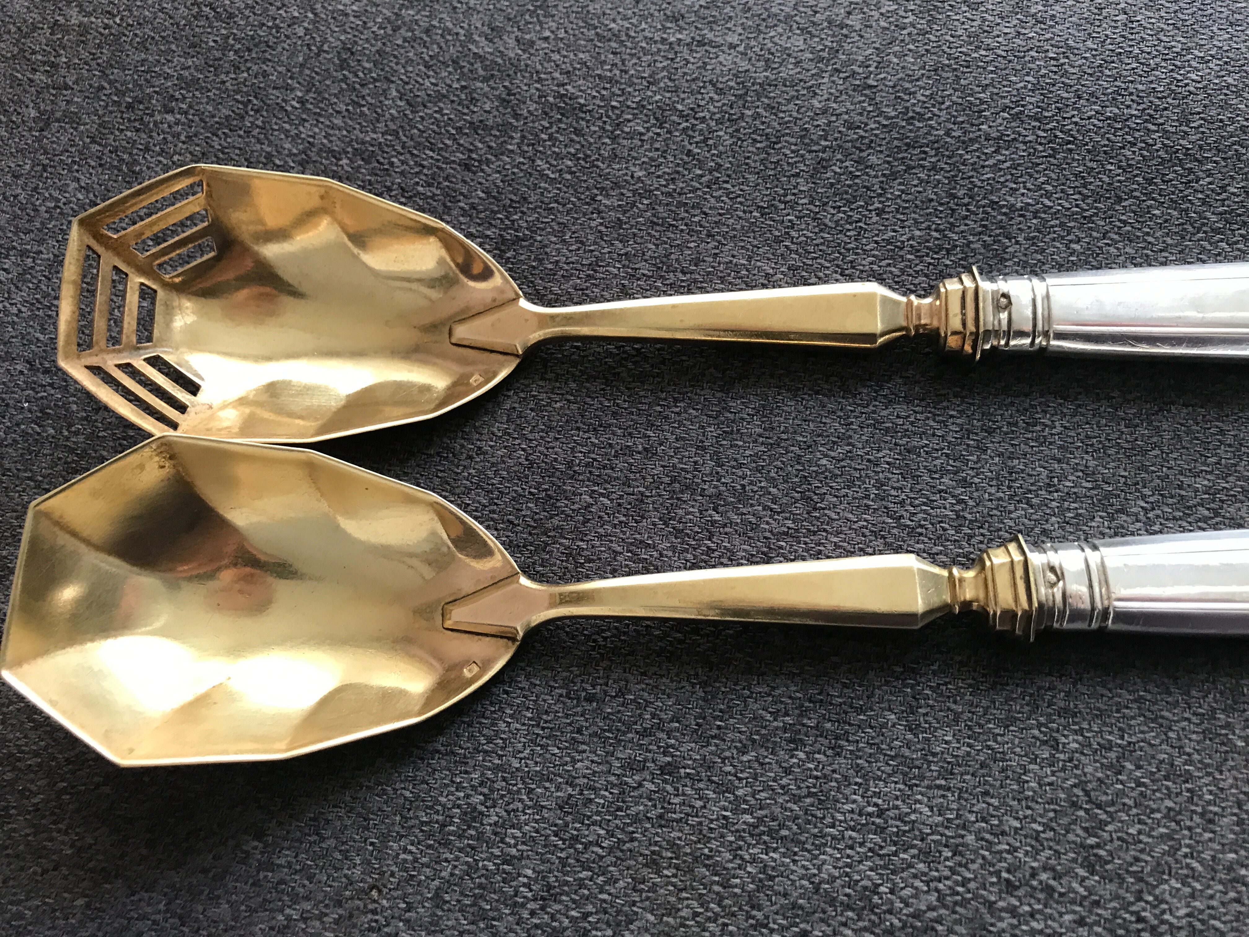 Pair of serving spoons in silver hallmark neck brace
