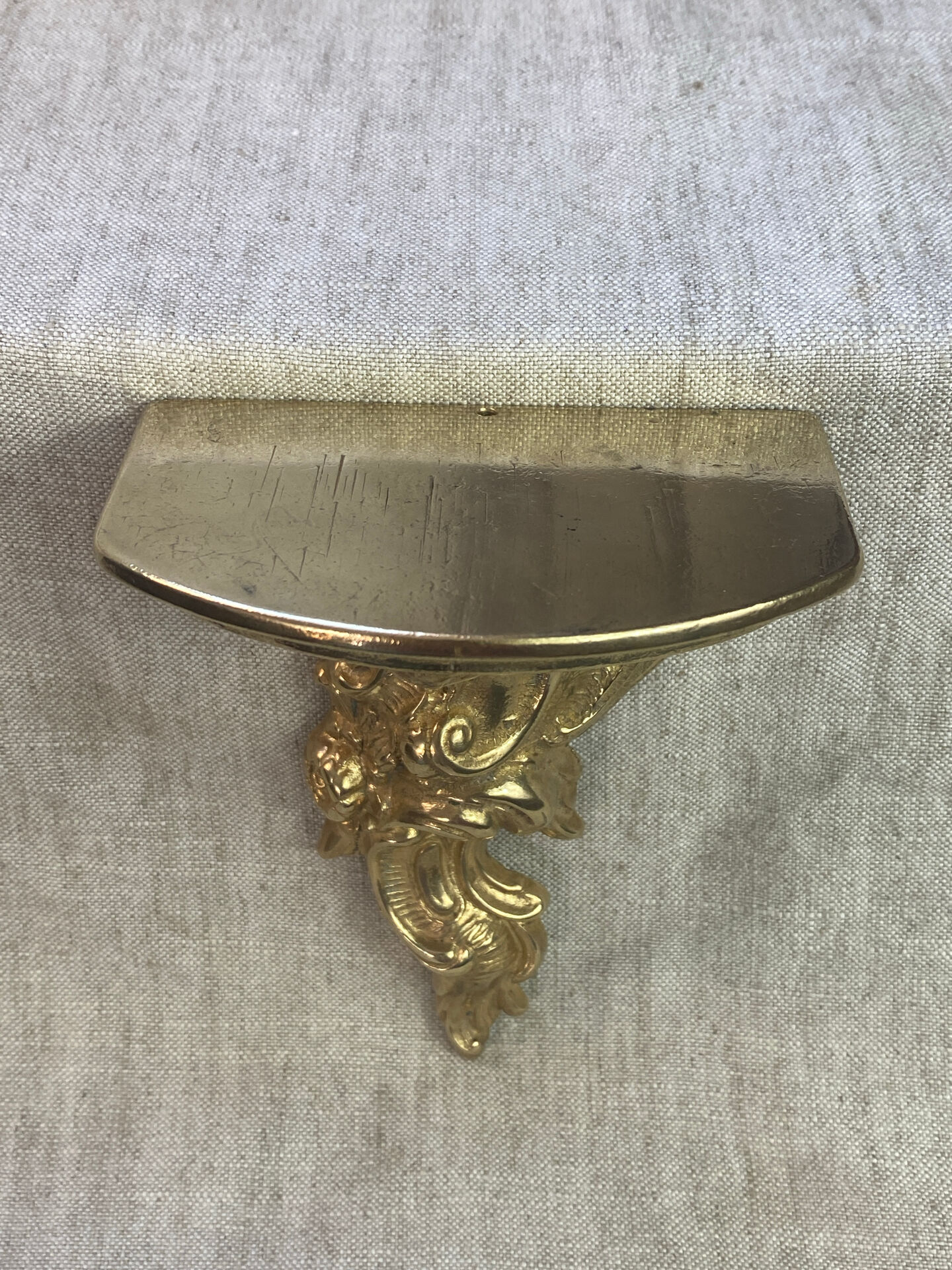 Small wall console in Rococo style in bronze