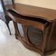 Curved mahogany display cabinet from the Napoleon III period. It has two doors and two shelves.