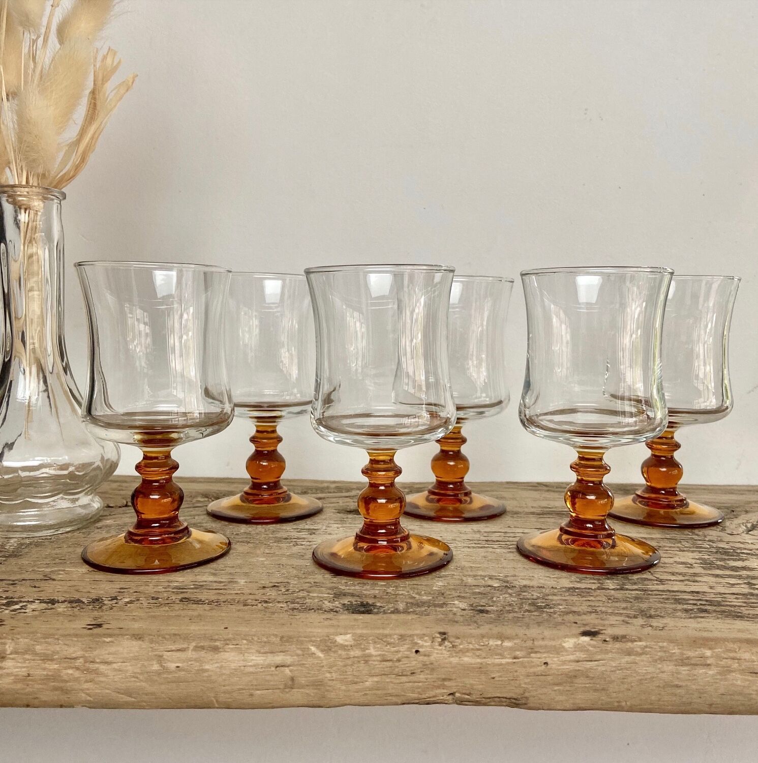 6 small amber-stemmed glasses