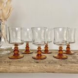6 small amber-stemmed glasses