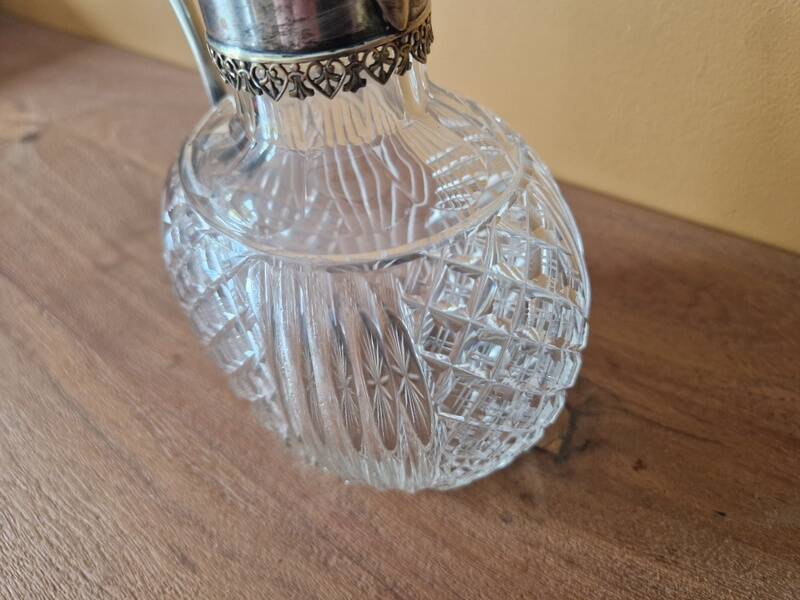 Cut crystal carafe and silver-plated metal