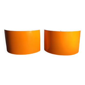 Pair of orange half-moon wall lights, 1970/1980