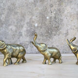 Three brass elephants