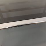 Vintage oval dining table in smoked glass and chrome metal, Space Age style.