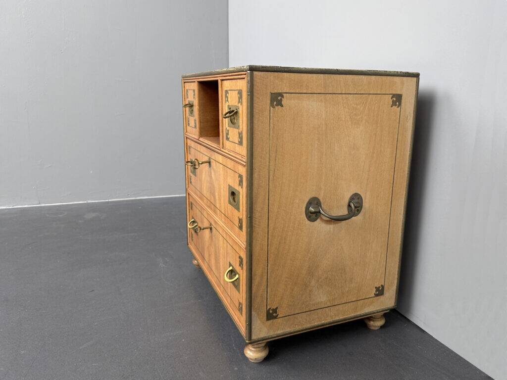 Antique campaign chest / ship’s chest, England, 1940s. Mahogany with a distinctive grain, brass inlays and hardware.