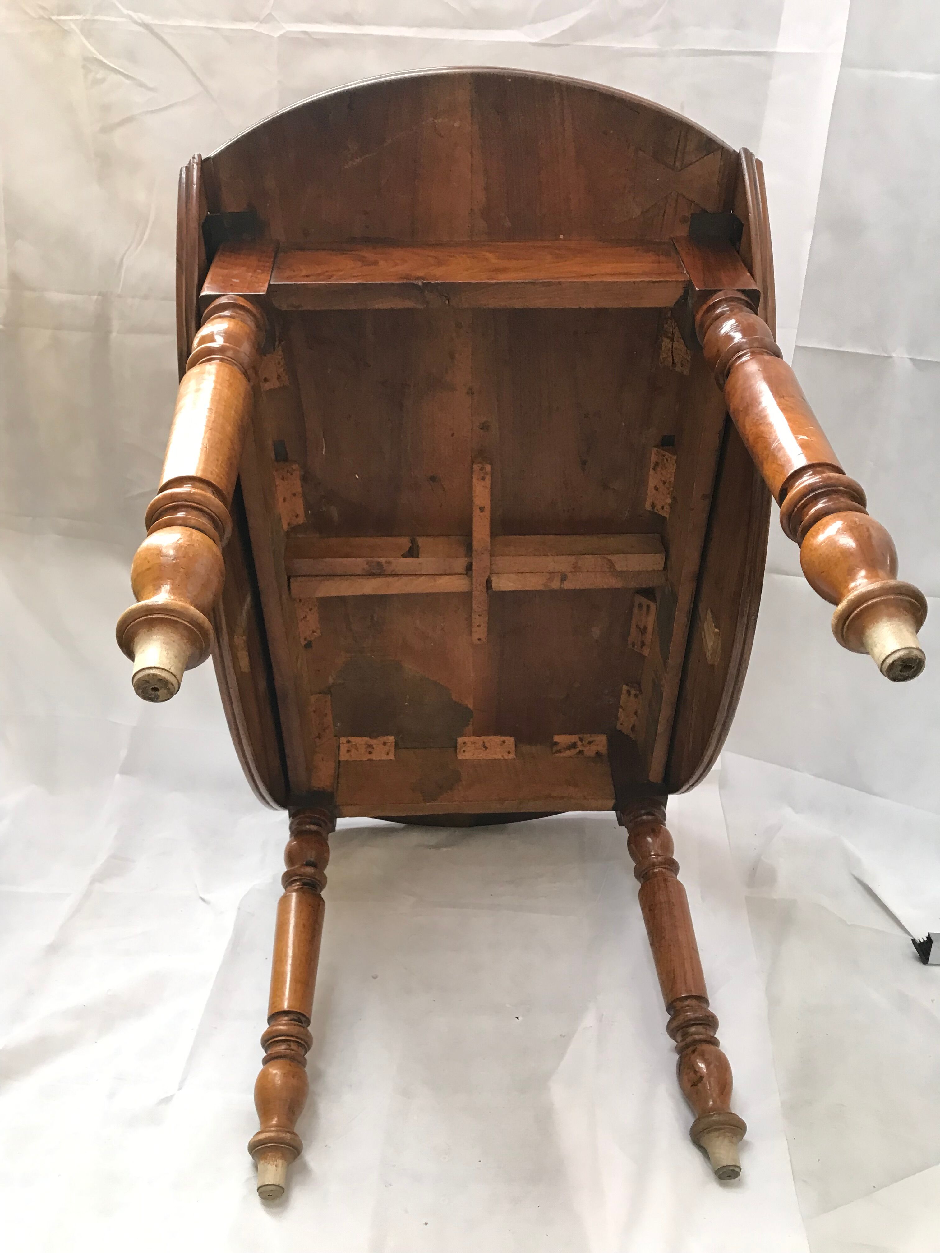 Oval wooden table with shutter