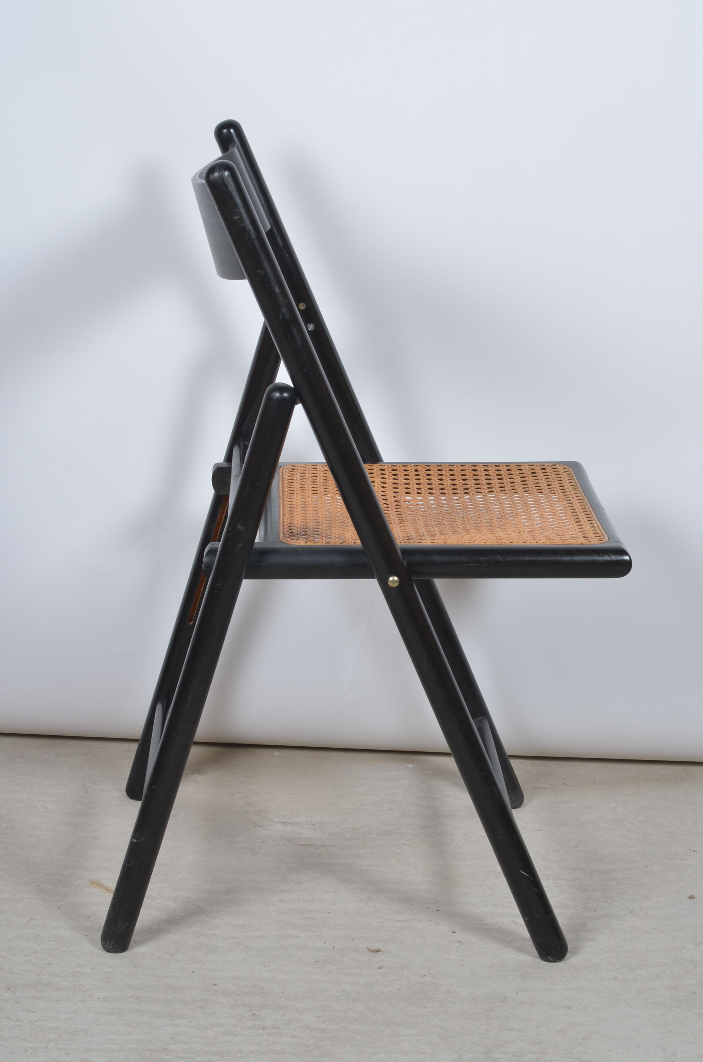 Folding chair seated in cannage