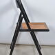 Folding chair seated in cannage