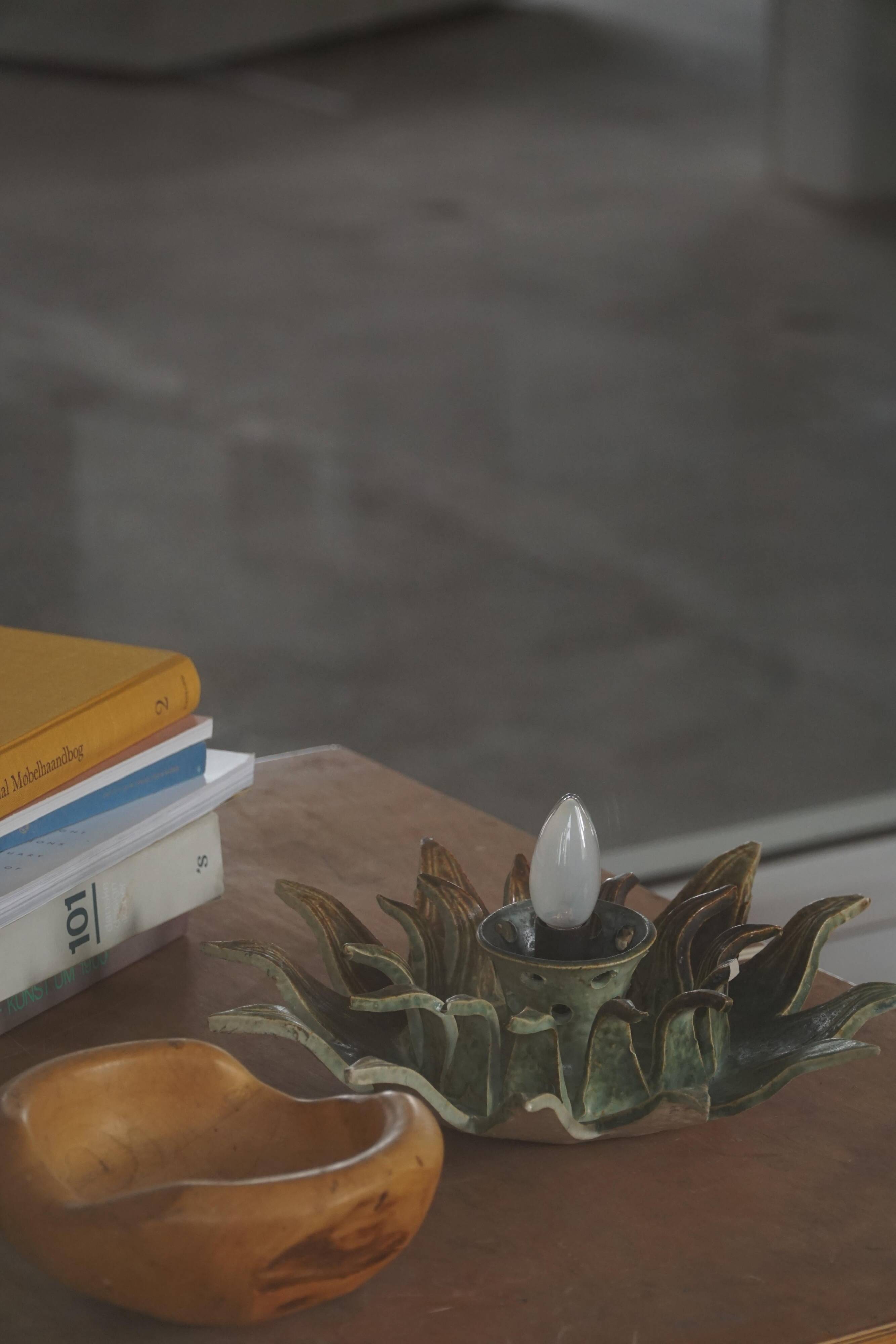 Mid-20th century ceramic sun wall lamp or decorative wall sculpture, 1960s.