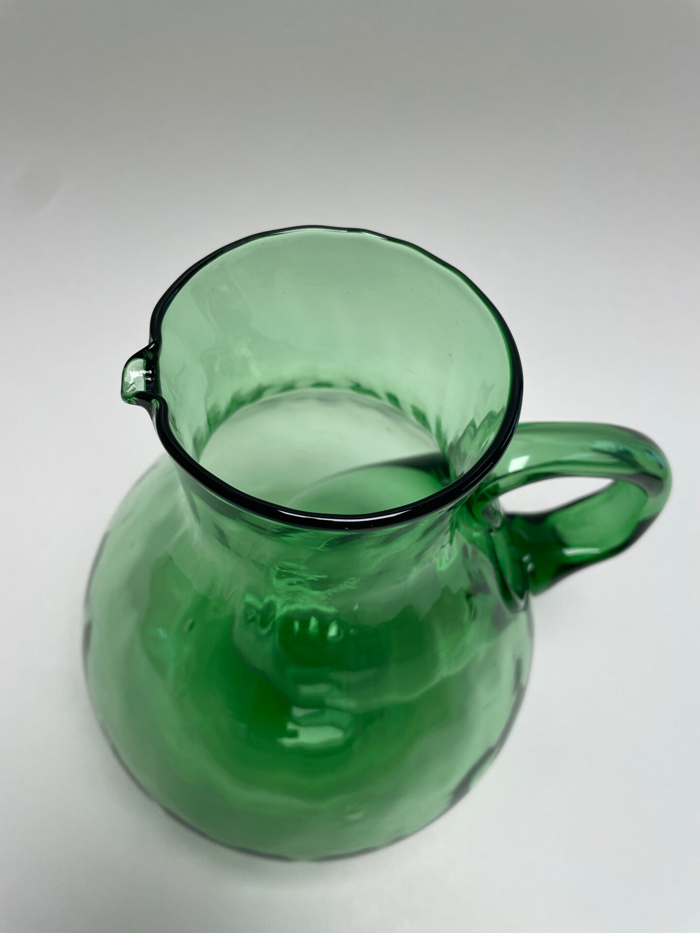 Large green glass cooling jug
