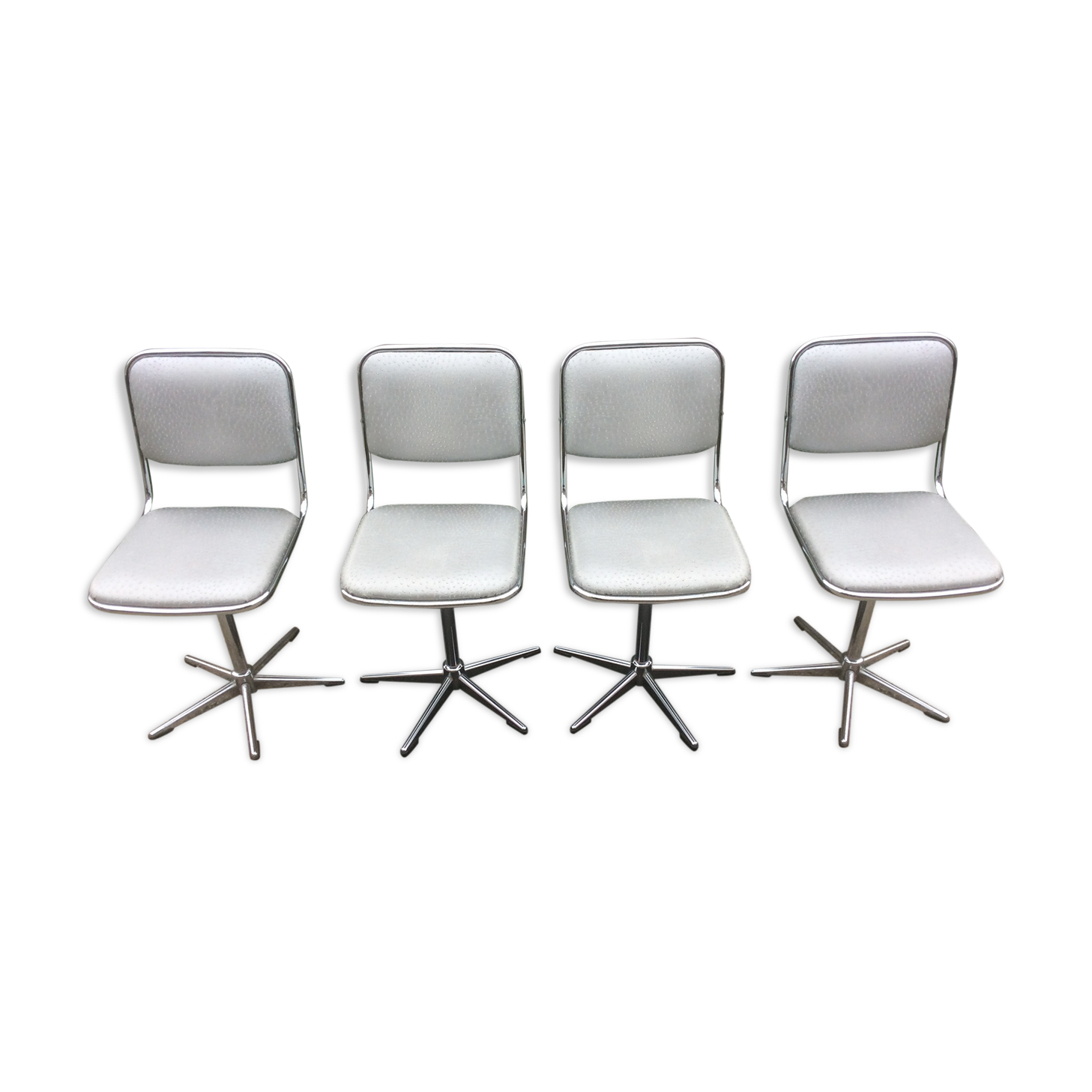 Vintage swivel chairs with chrome tubular base and silver skaï brand unic desing.