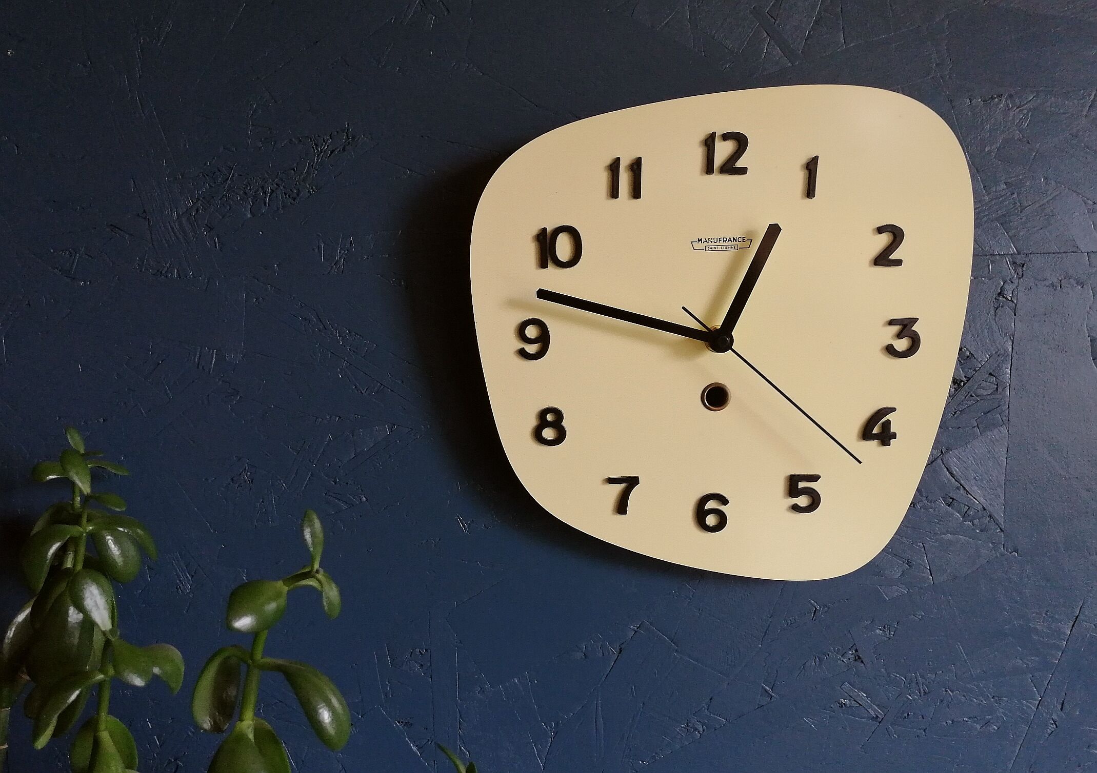 Clock formica vintage asymmetrical silent wall clock "Manufrance pale yellow"