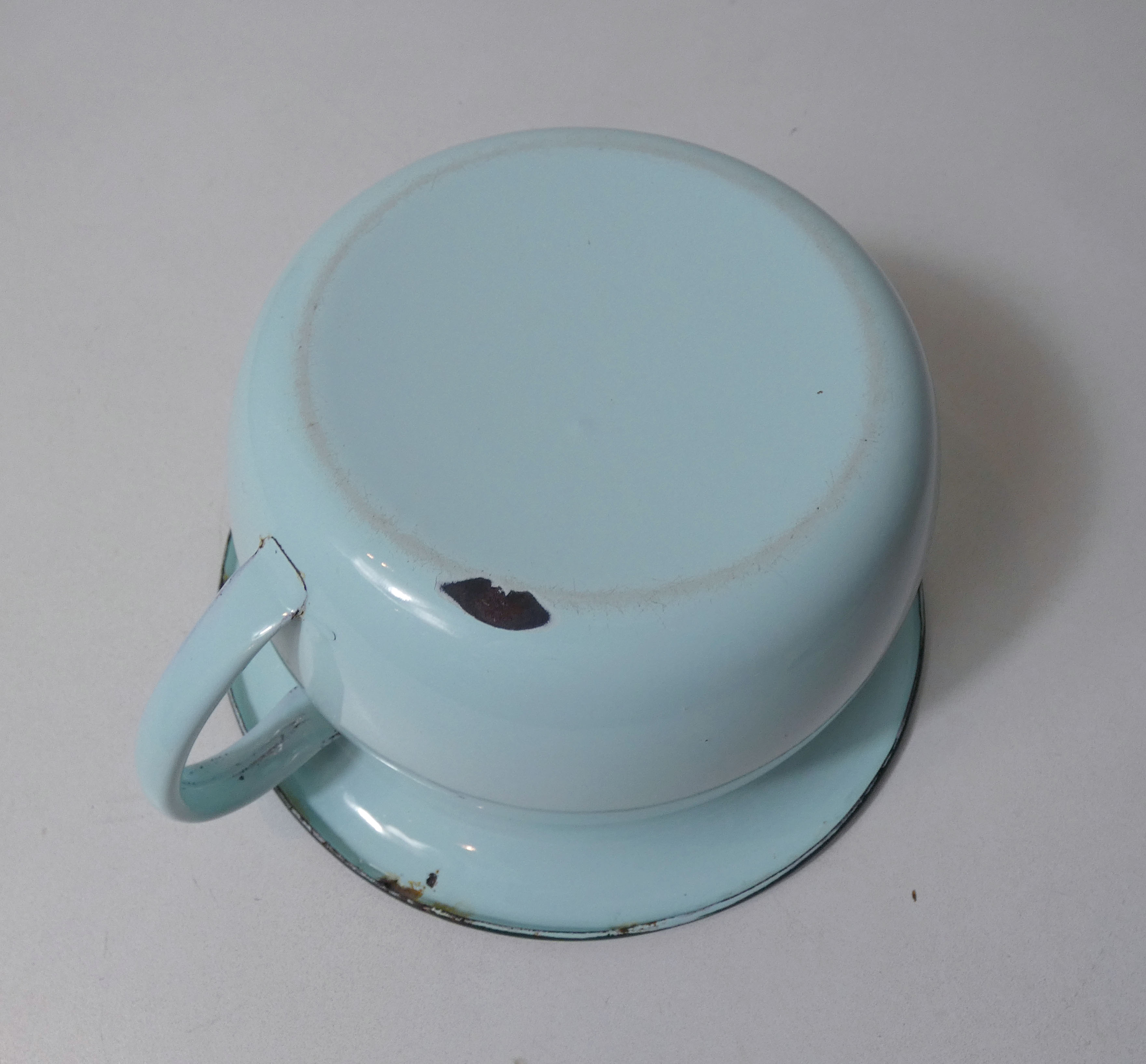 Old green enamelled steel pot cover