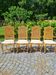 4 chaises en bois cérusé et dossier canné