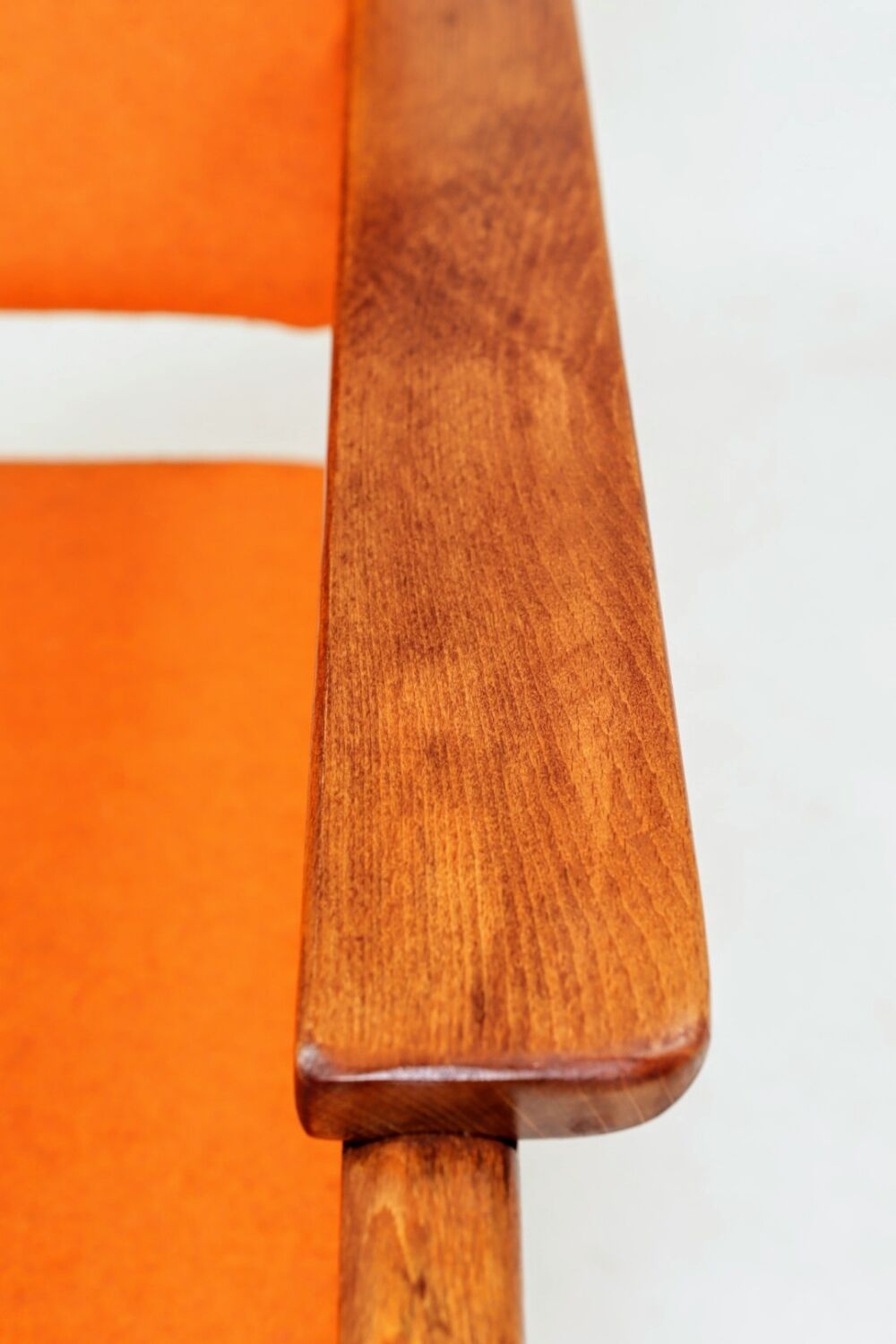 Vintage armchair in papaya orange wool from the 1960s.