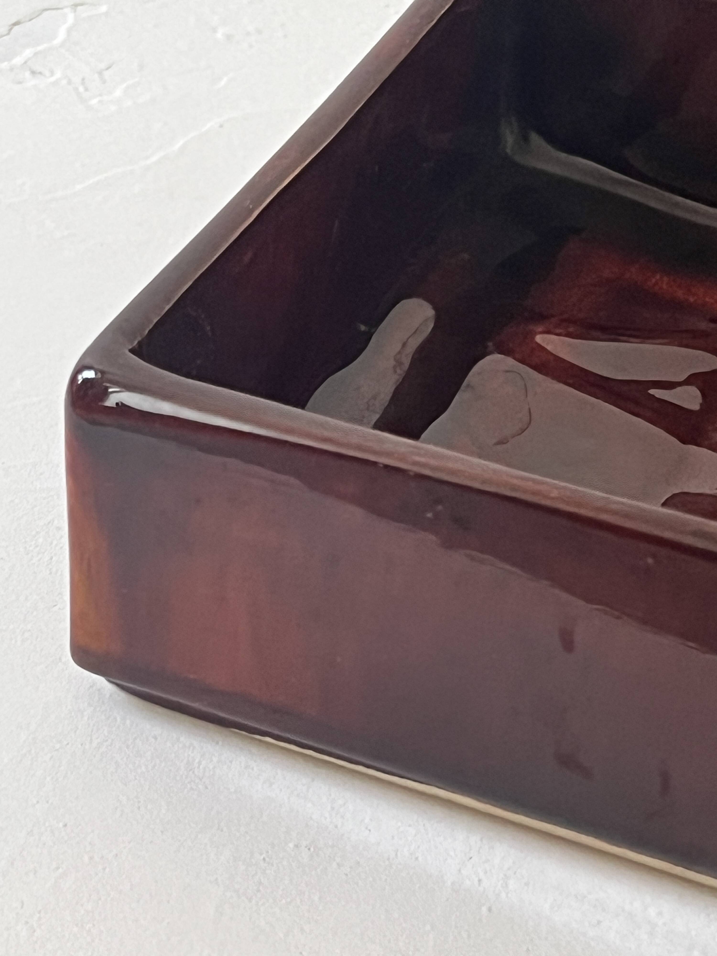 Bordeaux ceramic enamelled vide poche by Dutch artist A. Reuver, numbered.