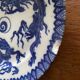 Asian porcelain plates decorated with blue dragons