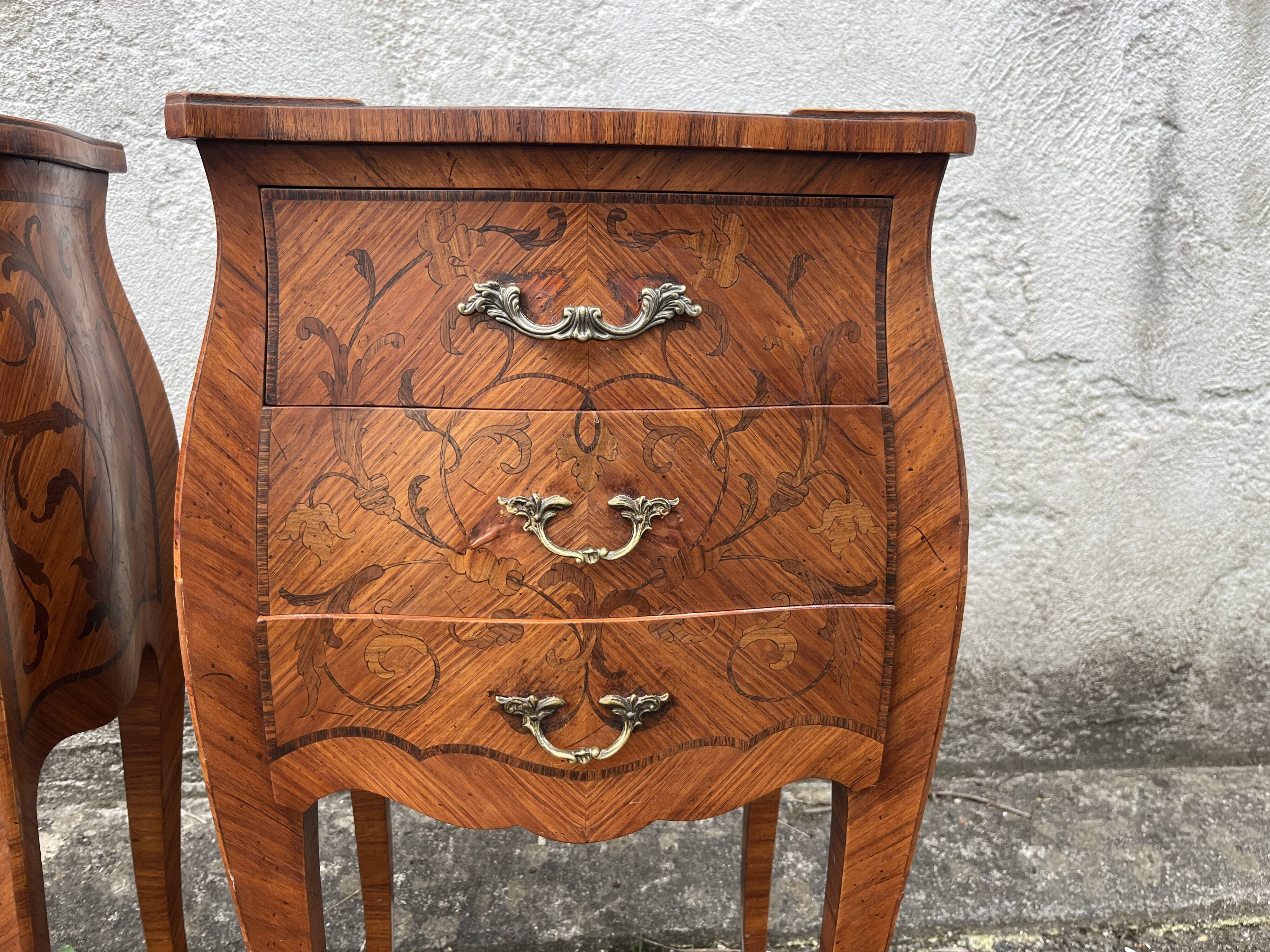 Pair of bedside tables with bombé shape, marquetry, and bronze in Louis XV style.