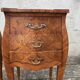 Pair of bedside tables with bombé shape, marquetry, and bronze in Louis XV style.