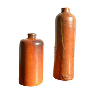 Lot of two enamelled sandstone bottles