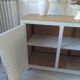Vintage low sideboard with 3 doors, pearl gray patina, wooden top.