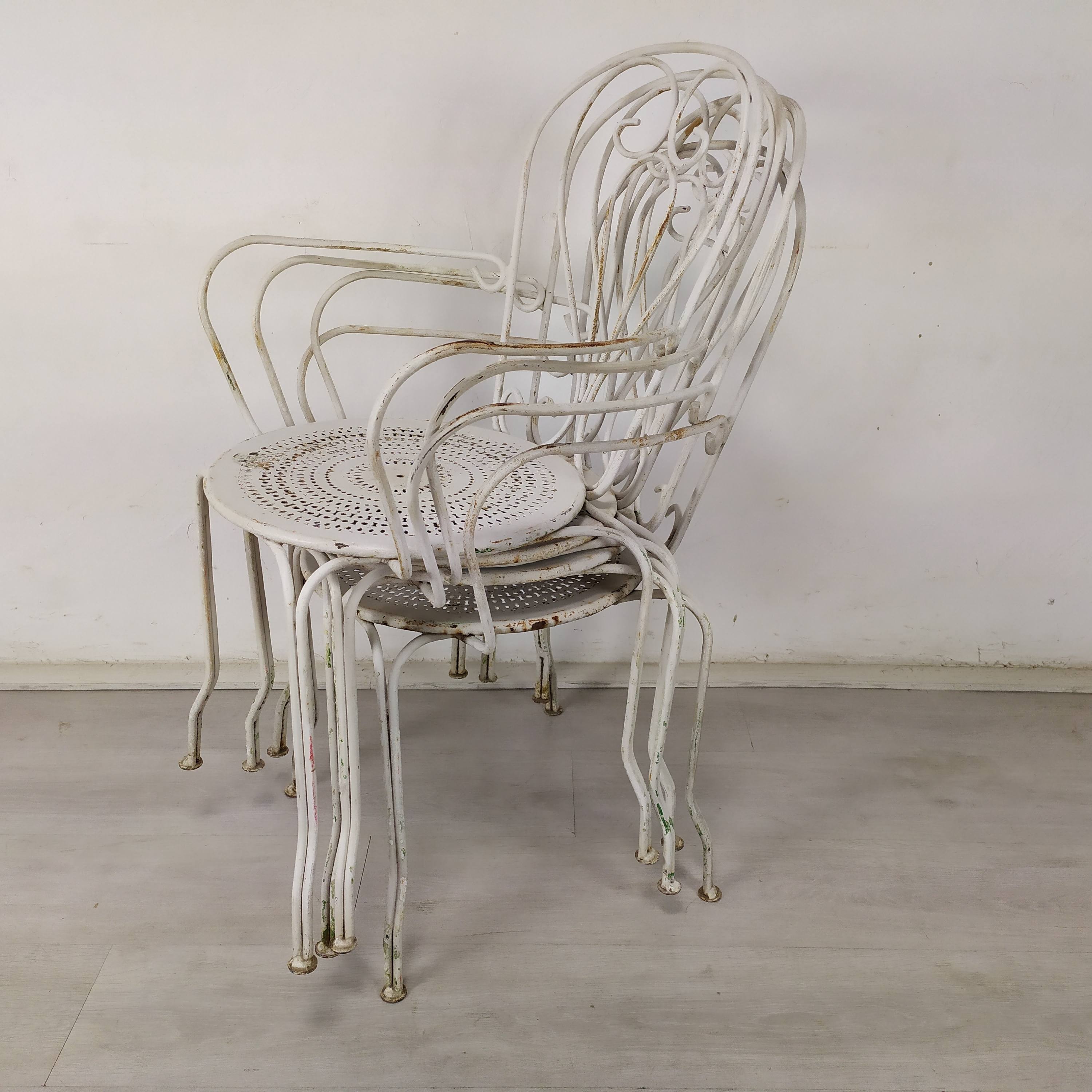 4 wrought iron garden armchairs