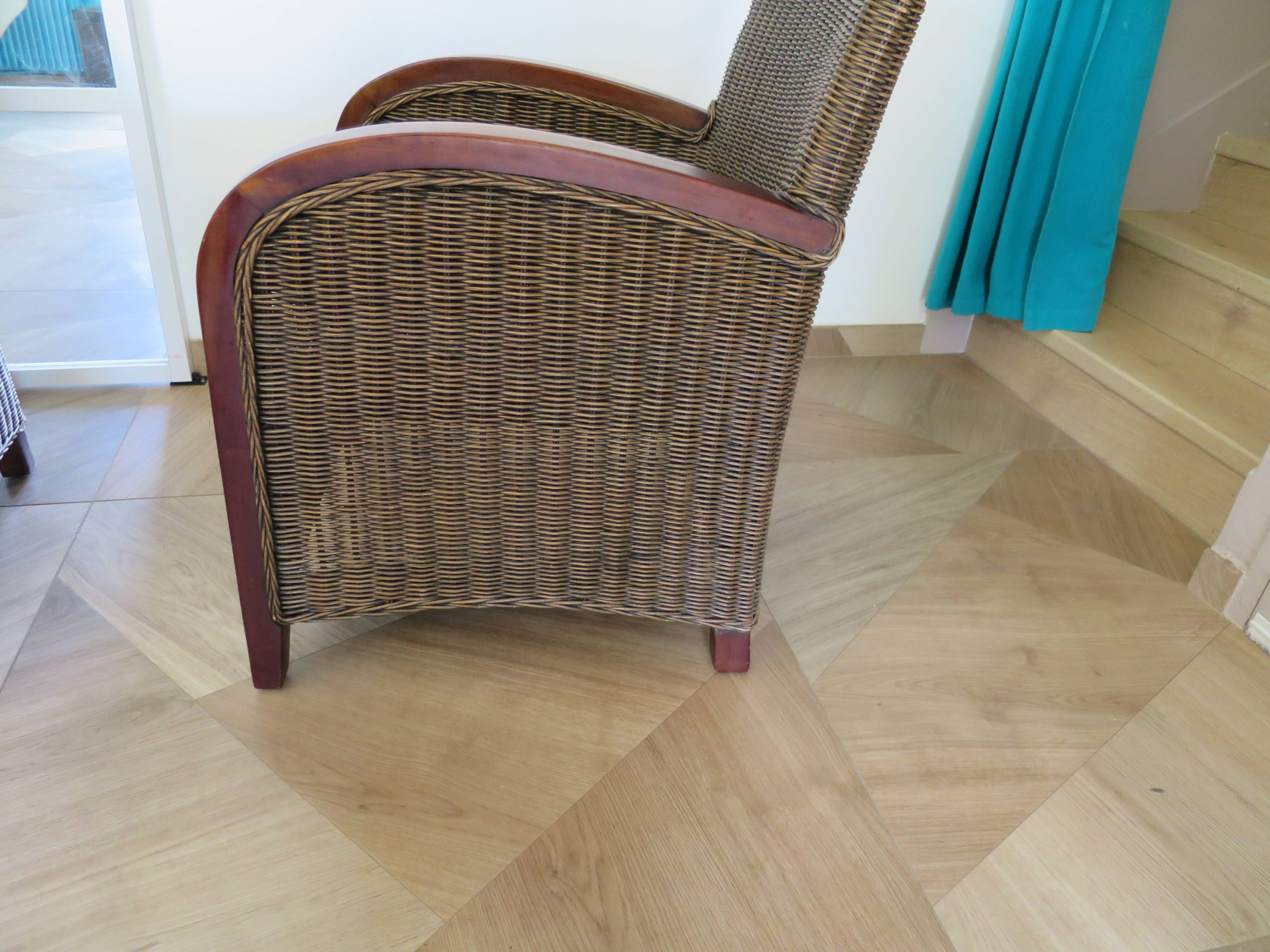 2 armchairs in woven rattan and wood, 1980s