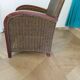 2 armchairs in woven rattan and wood, 1980s
