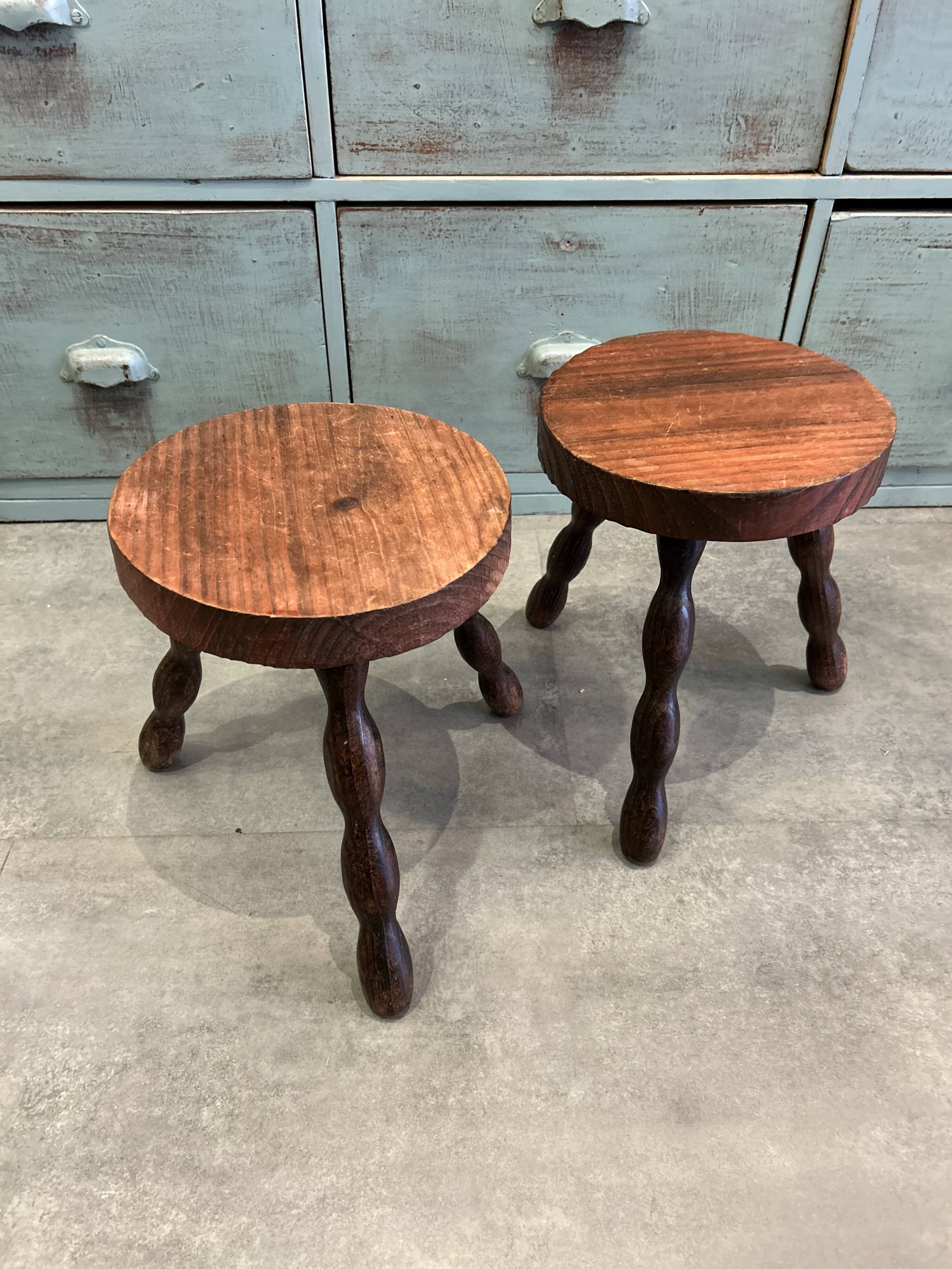 Three-legged stool with beaded wooden legs