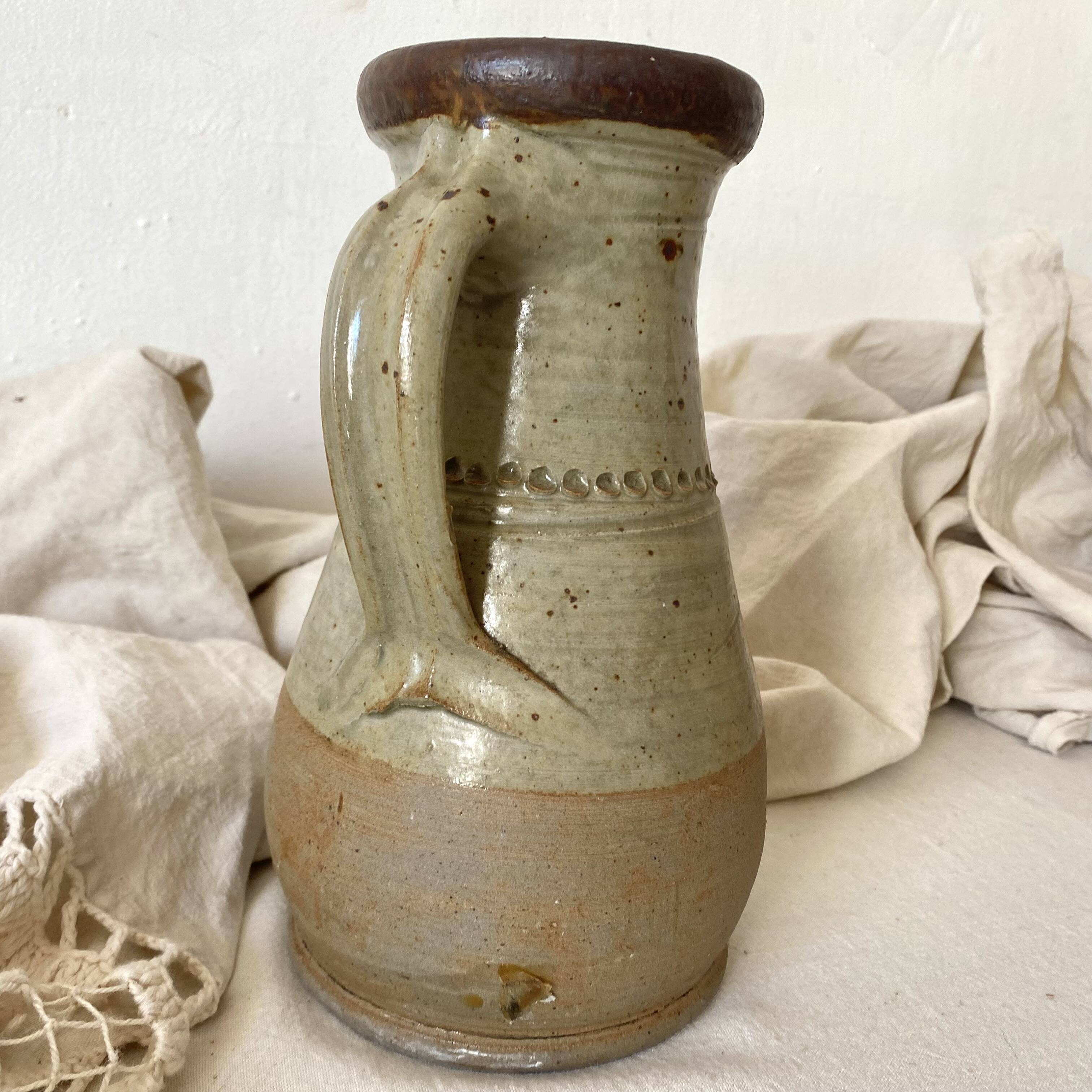 Vintage handcrafted terracotta pitcher
