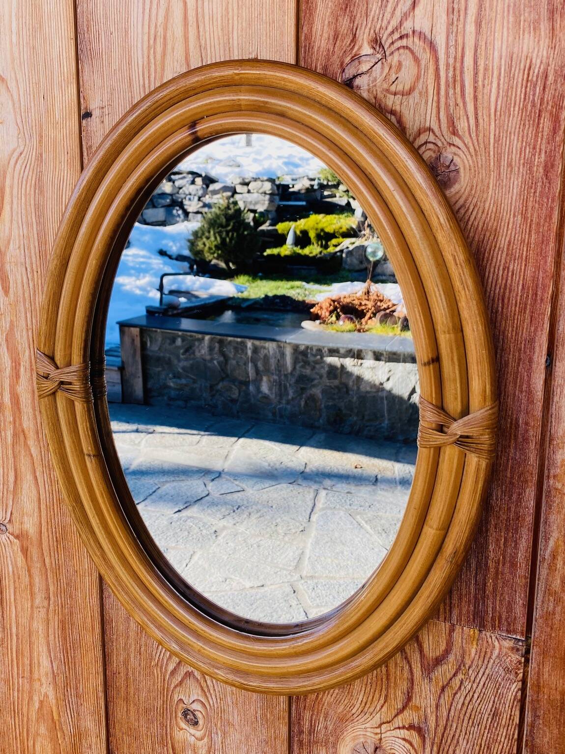 Vintage oval rattan mirror