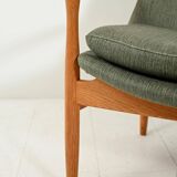 Scandinavian oak and sage-green wool armchair
