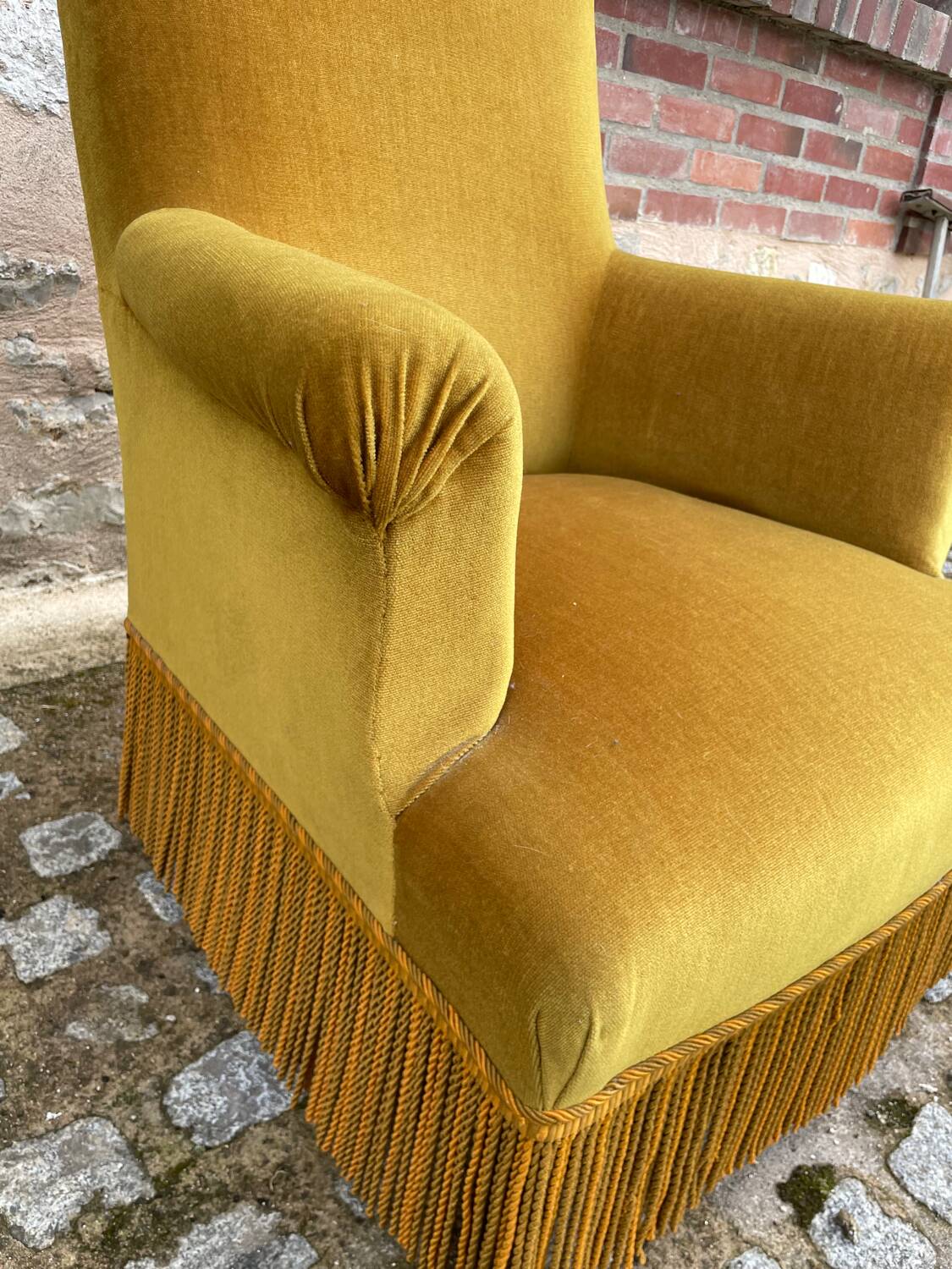 Mustard yellow velvet toad armchair with fringes