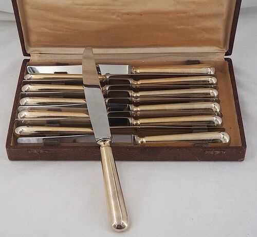 12 table knives model Baguette, golden handles, excellent condition.