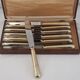 12 table knives model Baguette, golden handles, excellent condition.