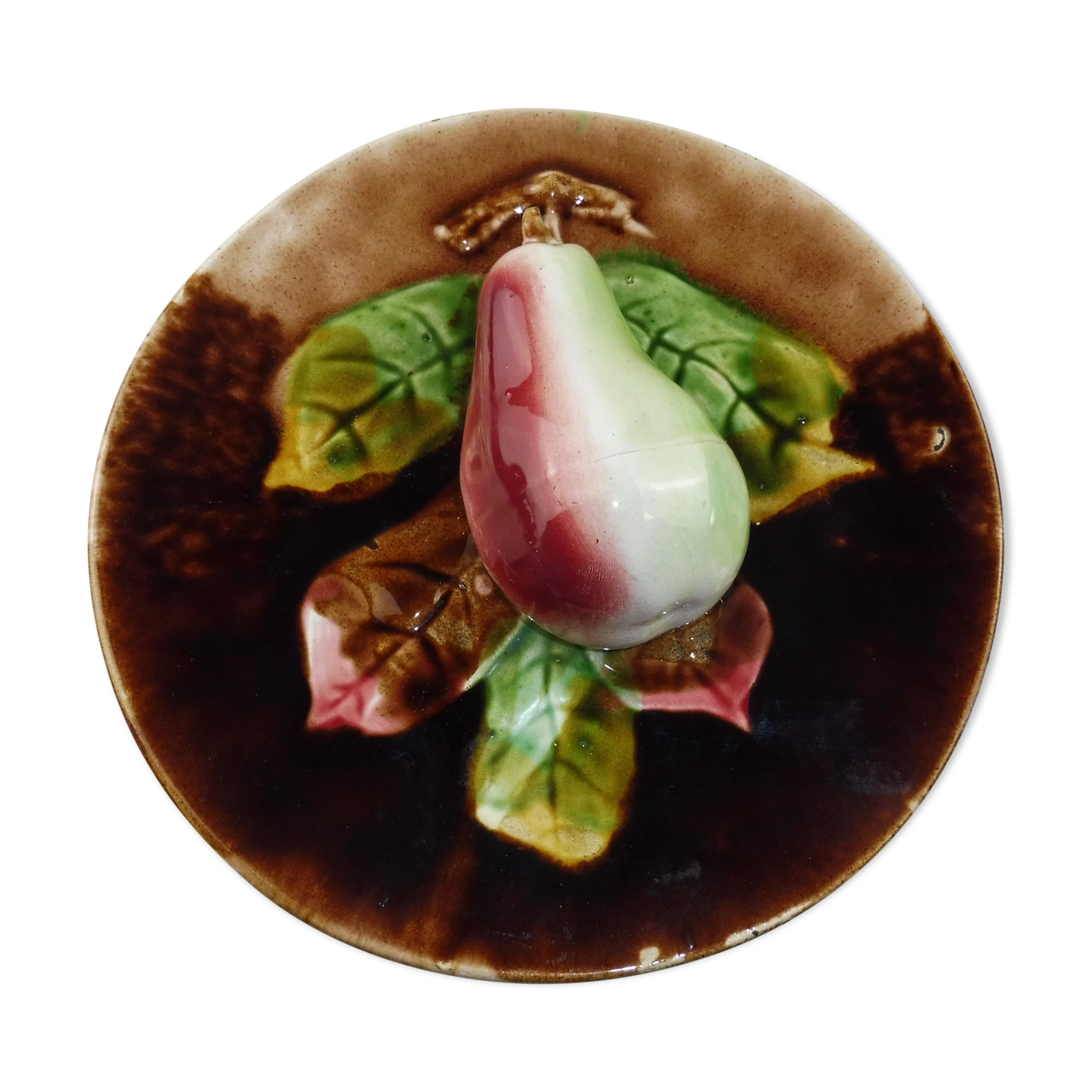 Old plate in dabbling, pear in relief