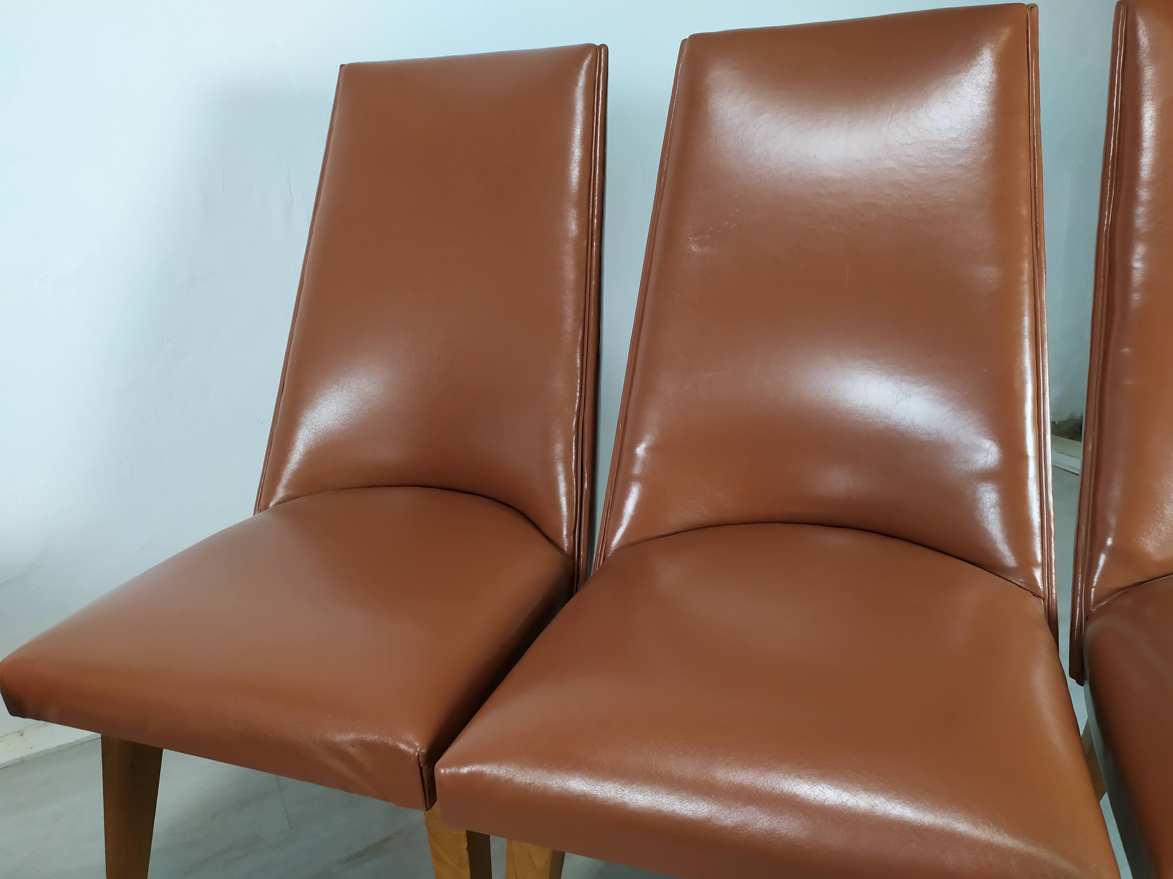 8 brown skai chairs 1950
