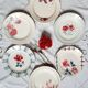 Old mismatched earthenware dinner plates