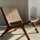 Reclining armchair in natural wood and woven rattan