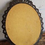 Baroque style oval metal mirror