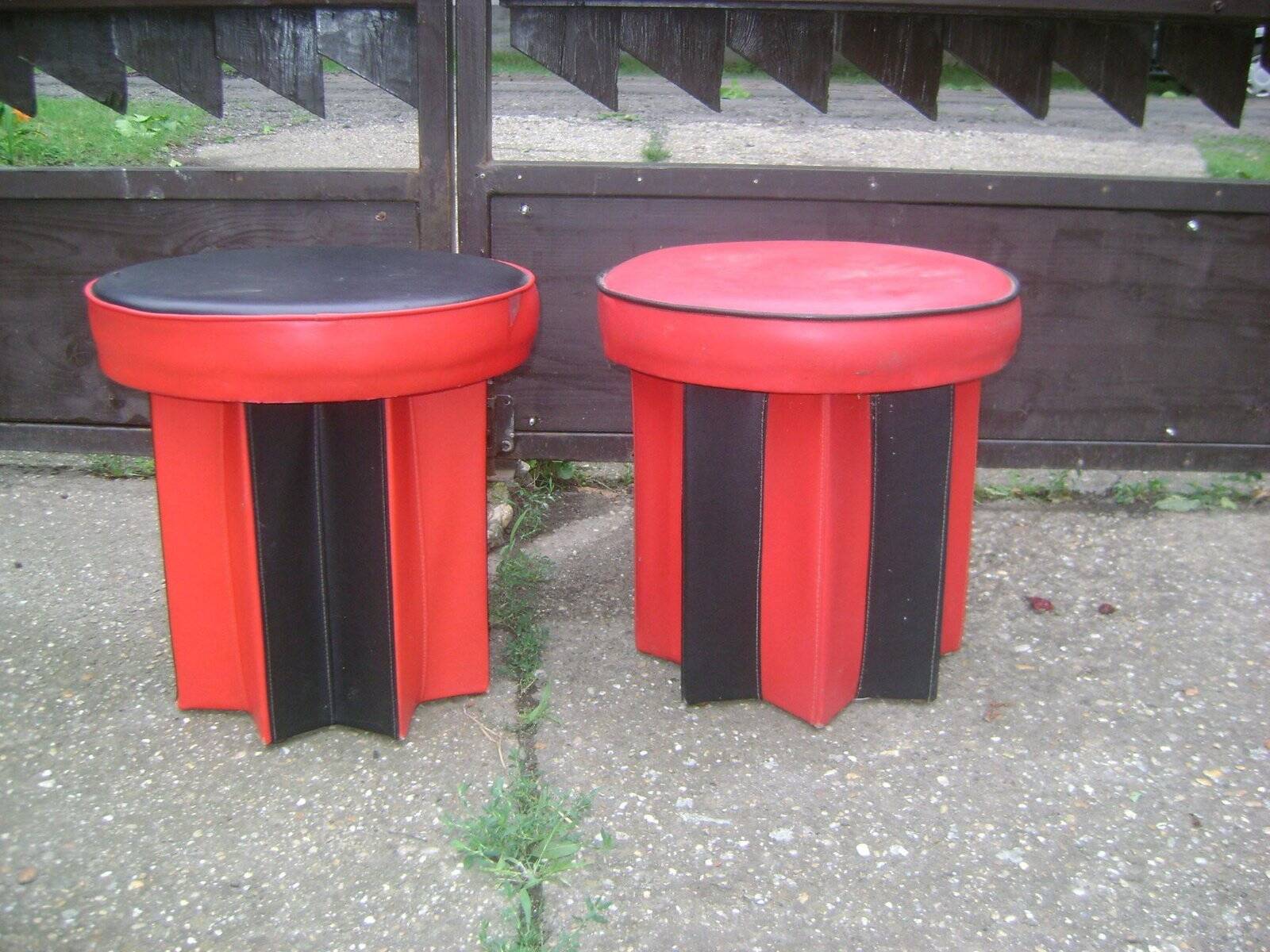 Set of mid-century black and red fabric stools, 1950s star base.