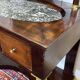 Empire hairdresser from the 19th century in mahogany with a marble top.