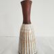 Small brown vintage vase with white enamels