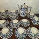 Henriot Quimper earthenware coffee set with floral decoration and elegant blue