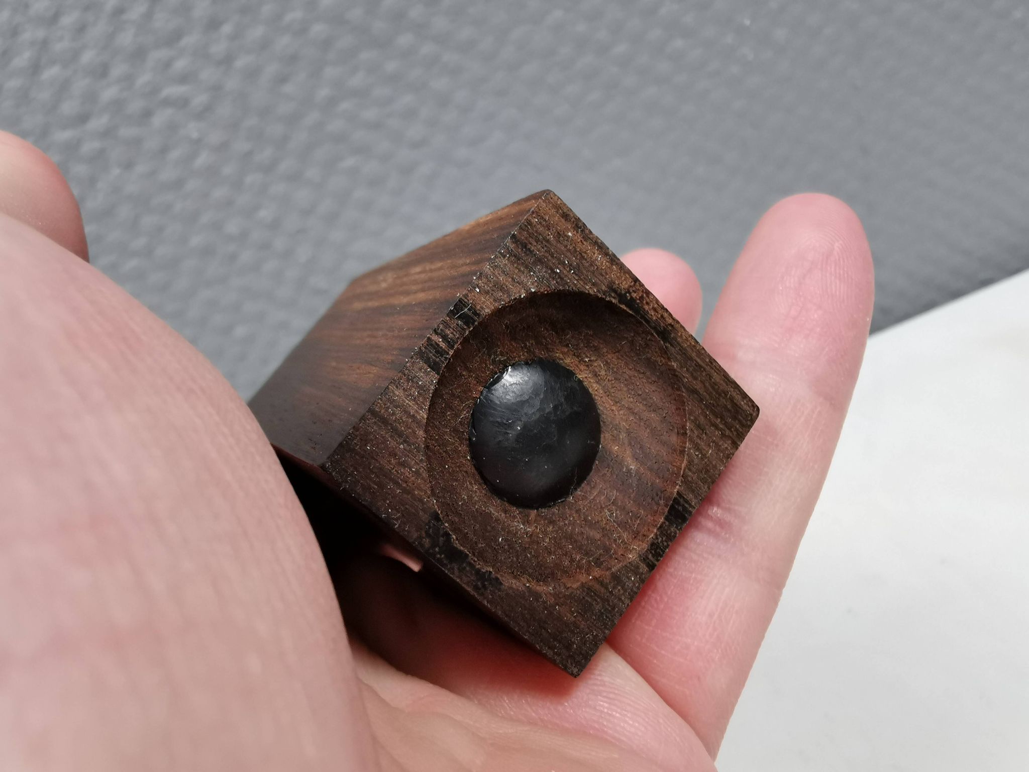 A set of salt and pepper shakers in rosewood