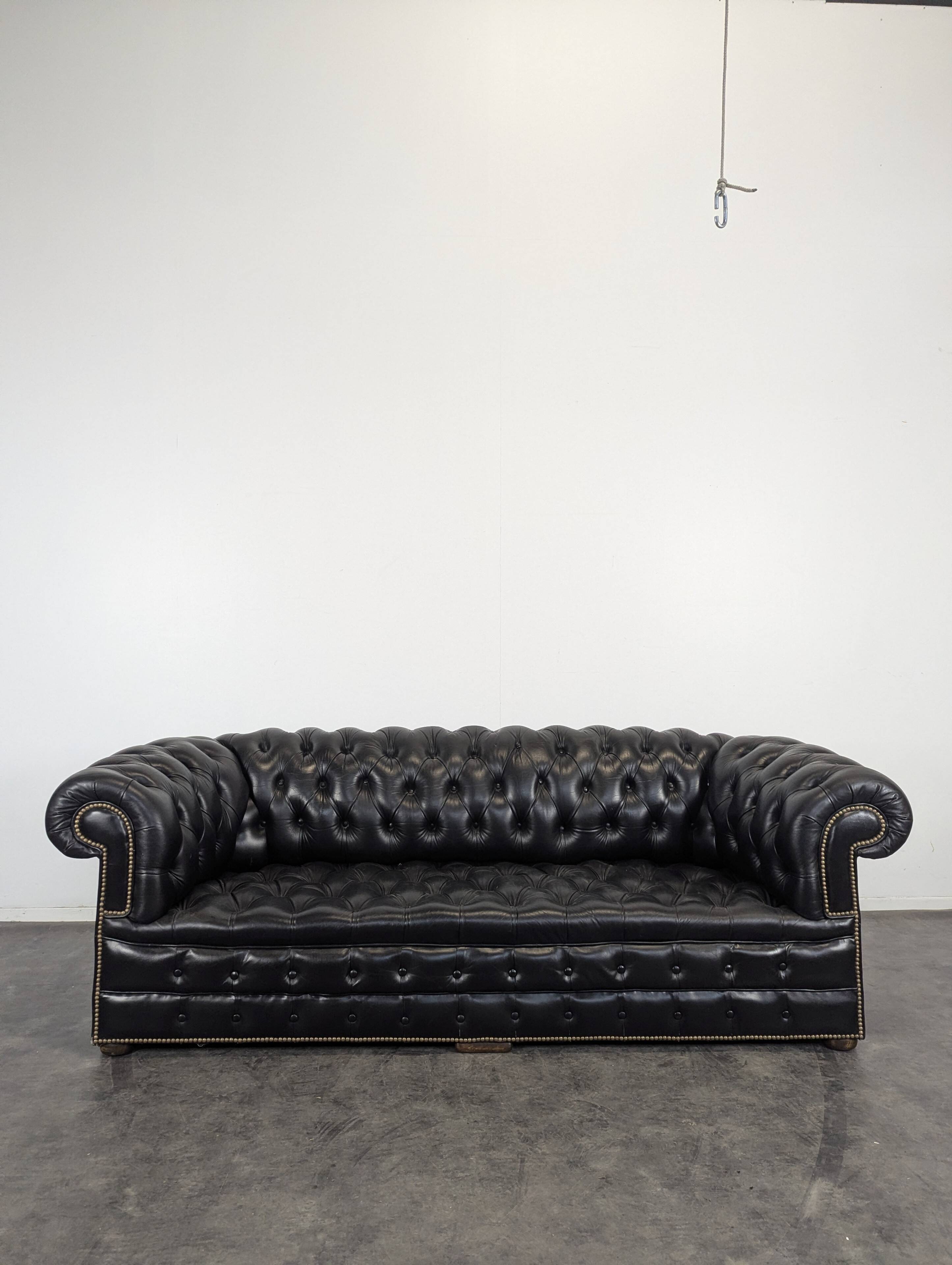 Black Chesterfield sofa for 4 people