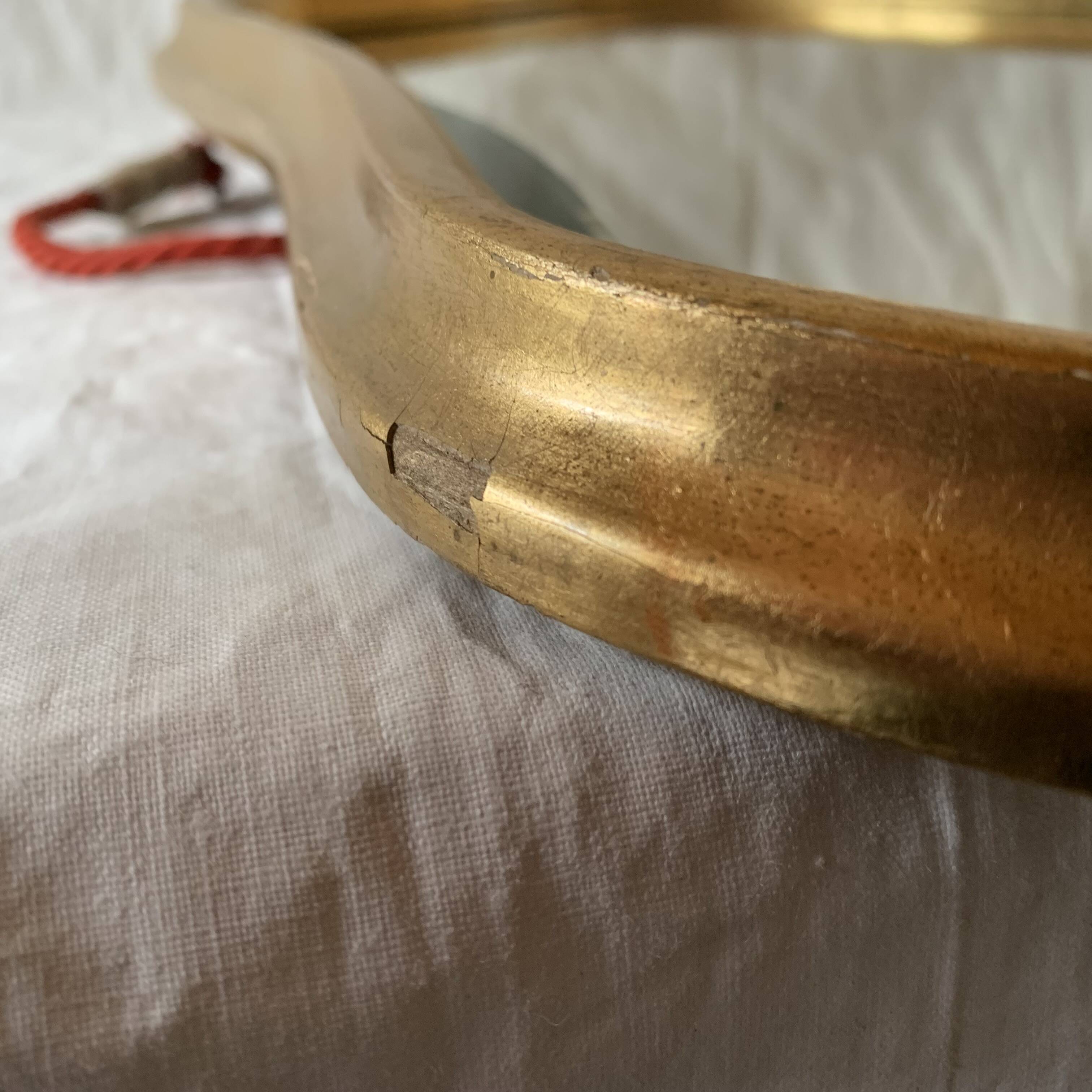 Antique beveled wall mirror in gilded solid wood