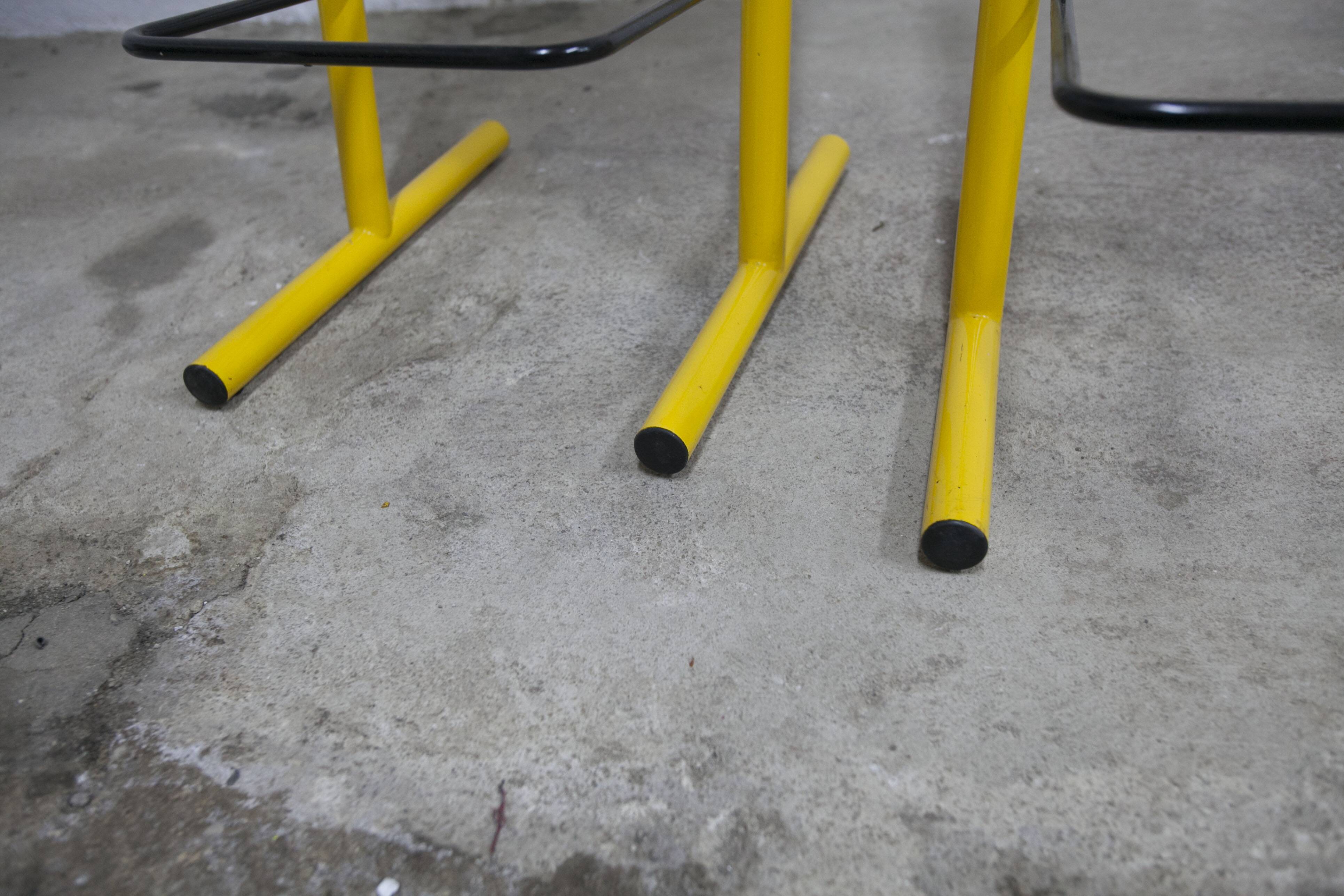 Pair of adjustable Italian bar stools in lacquered yellow and black